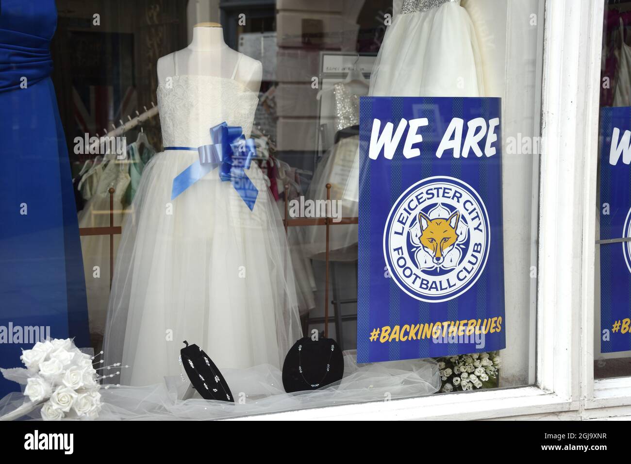 LEICSTER 2016-05-02 The merchandise from football team Leicester City are  seen in a window of t a wedding gown shop the city of Leicester, England,  May 2, 2016. This evening Leicester City, image size:1300x956