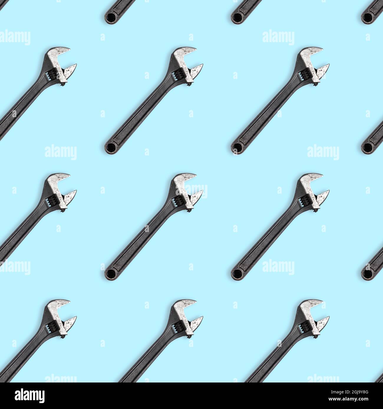 Seamless wrench pattern on light blue background. Repair service