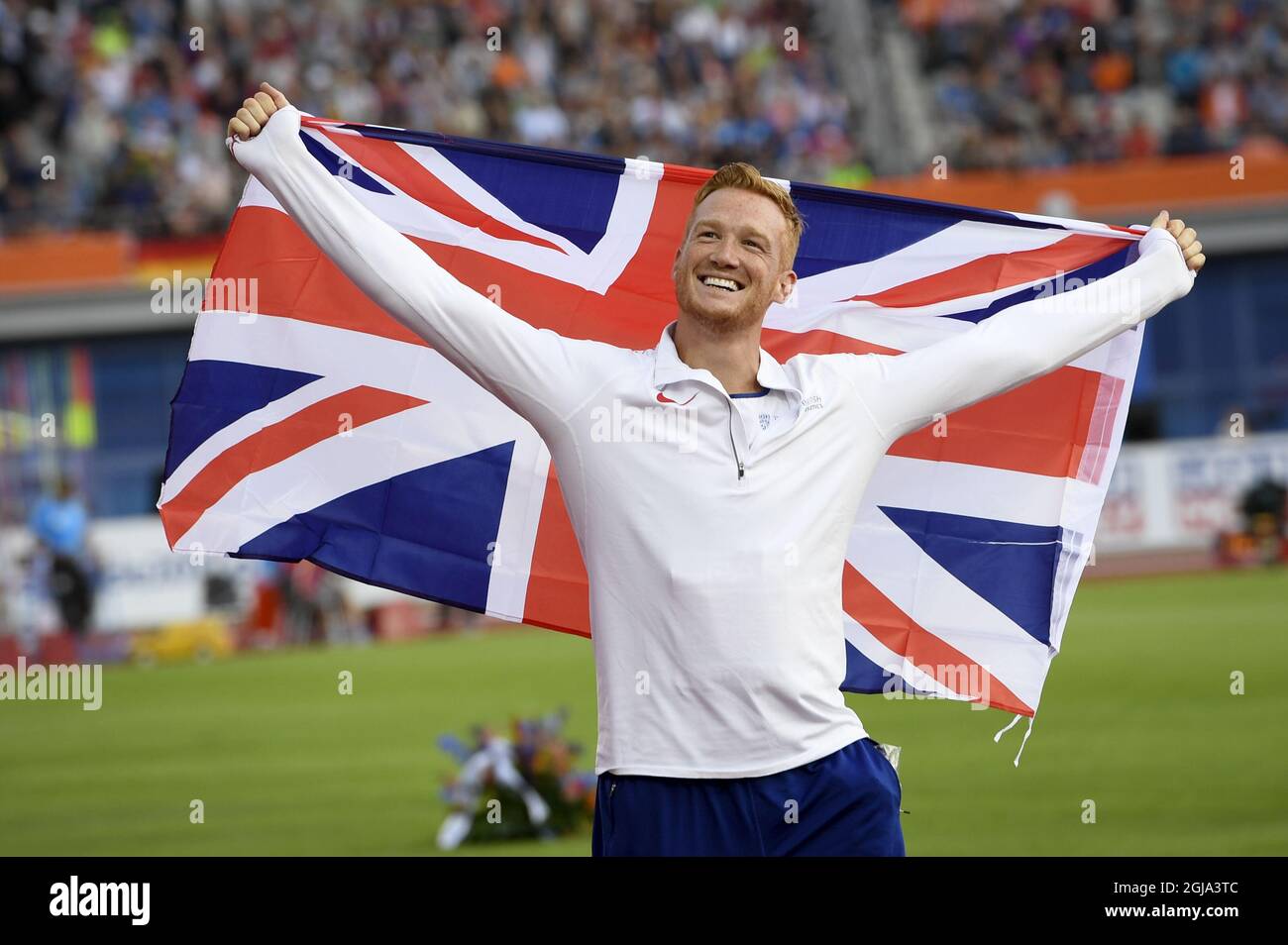 AMSTERDAM 20160707 Britain's Greg Rutherford poses with the flag after winning the men's long jump final during the European Athletics Championships in Amsterdam, the Netherlands, Thursday, July 7, 2016. Photo: Maja Suslin / TT / code 10300  Stock Photo