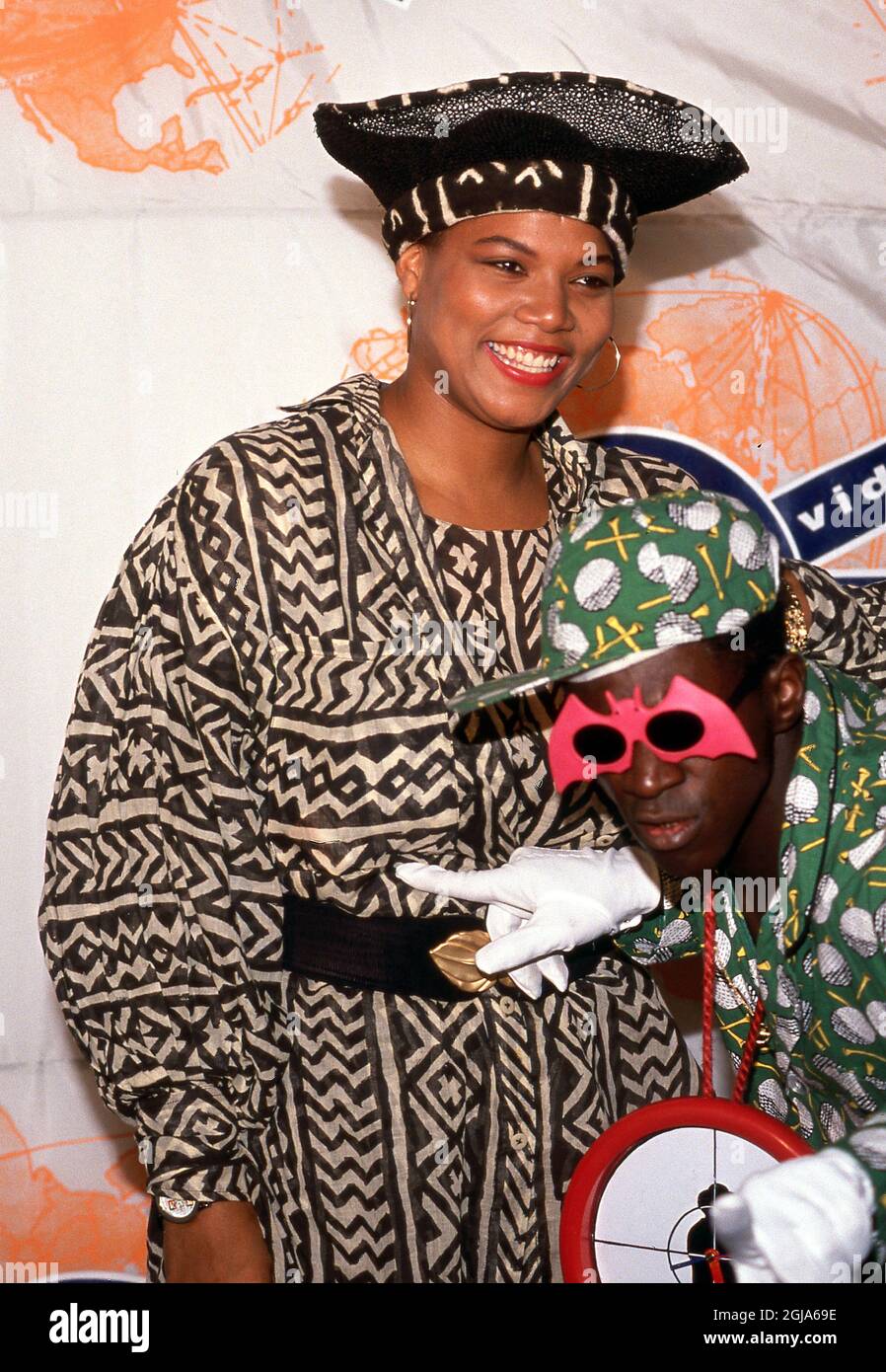 Queen Latifah and Flavor Flav at the 1990 MTV Video Music Awards at in Los Angeles, California September 06, 1990 Credit: Ralph Dominguez/MediaPunch Stock Photo