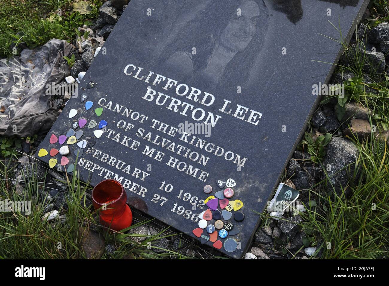 DORARP 2016-09-23 Guitar pics,candles, flowers and greeting from fans are  seen at the memorial stone for late musician Cliff Burton new Dorarps,  South Sweden, September 23, 2016 Clifford Lee Burton died when