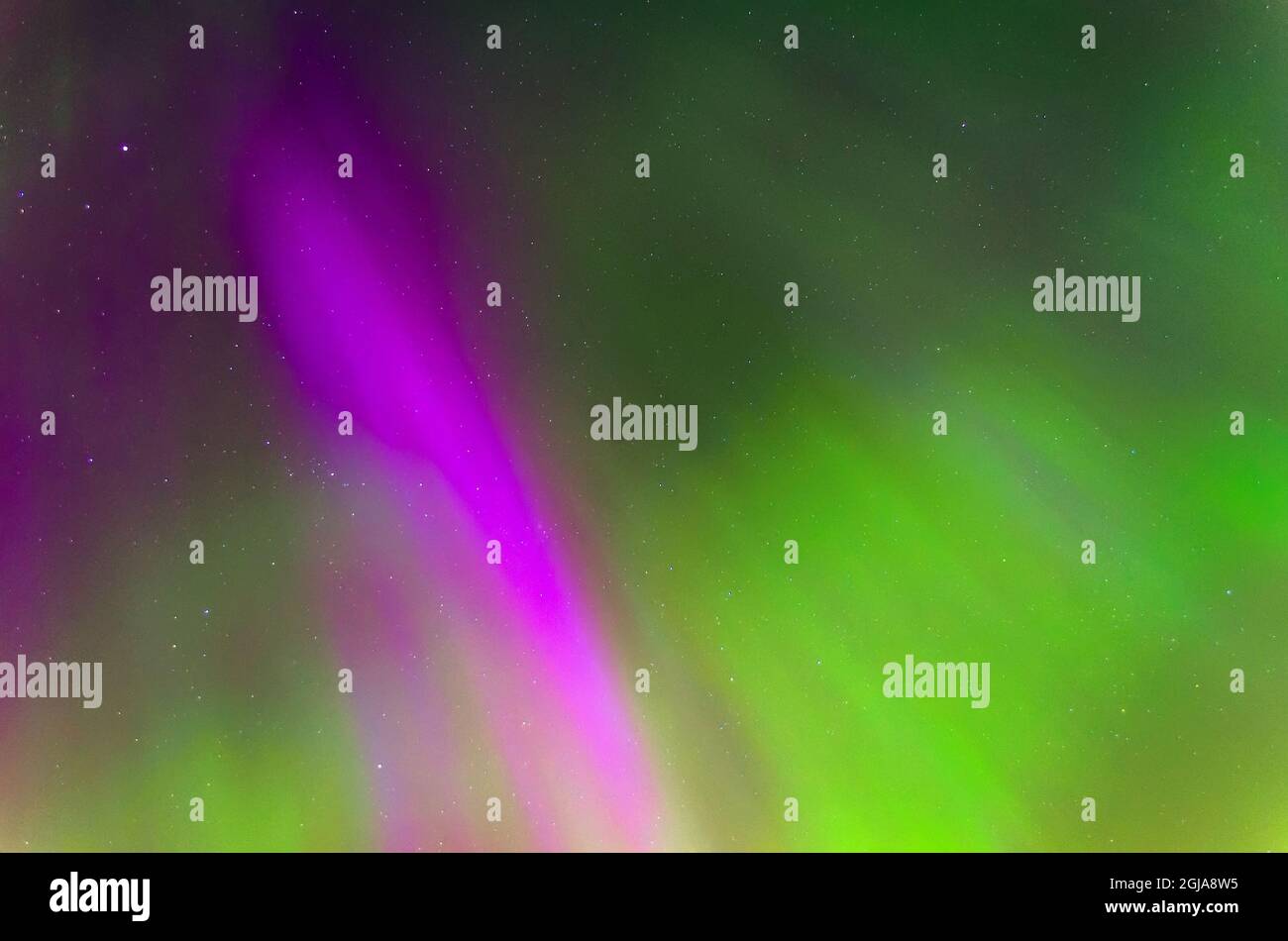 Polar lights Aurora Borealis in the night starry sky, texture and