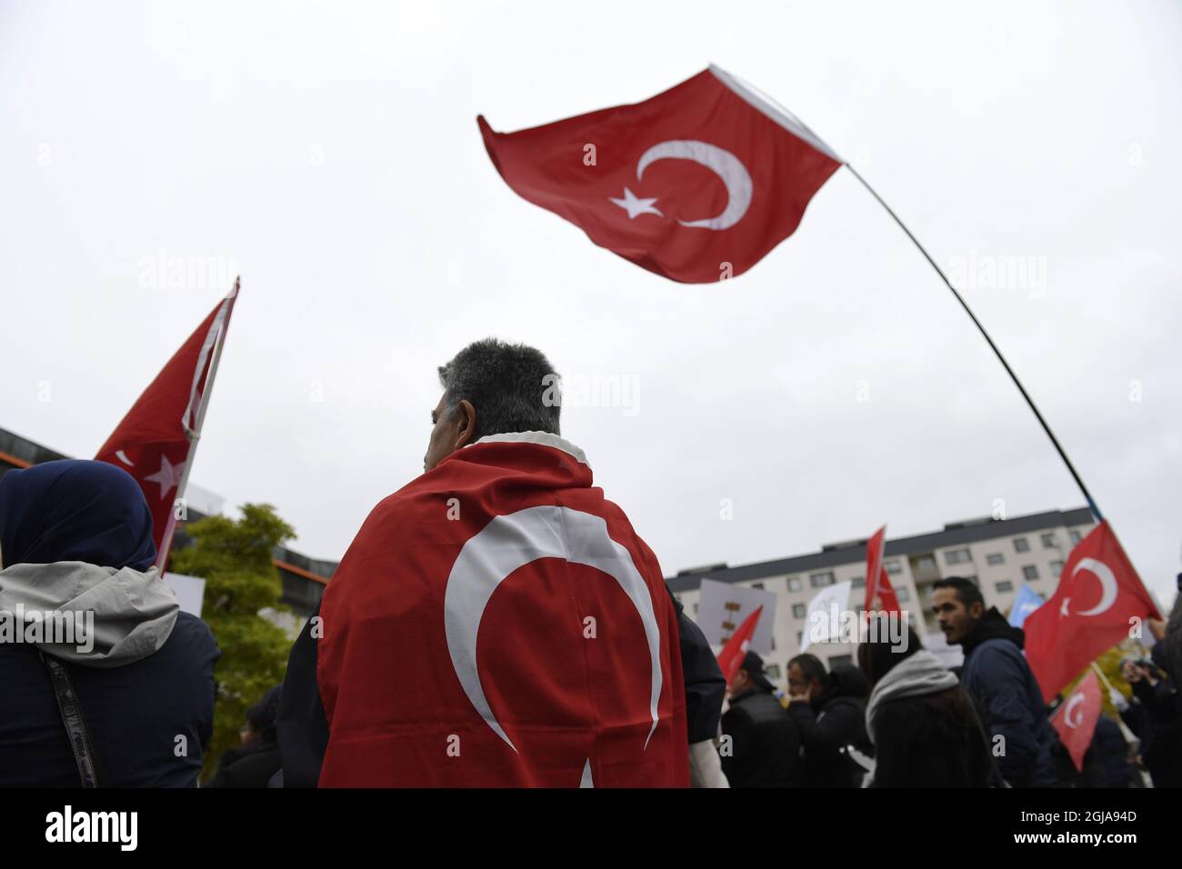 STOCKHOLM 2016-10-15 Turkish flags during a protest meeting outside the Bredangsskolan school in southern Stockholm, Sweden, October 15, 2015, following the cancellation of the panel 'July 15th -- Behind the Scene of the Bloody Coup'. Bo Andersson, head of the school were the panel was to be held Saturday, says to the Swedish newspaper SvD that security concerns is the reason for the cancellation. The office of the Turkish prime minister has condemned the cancellation of the panel. Photo: Henrik Montgomery / TT / ** SWEDEN OUT ** Stock Photo