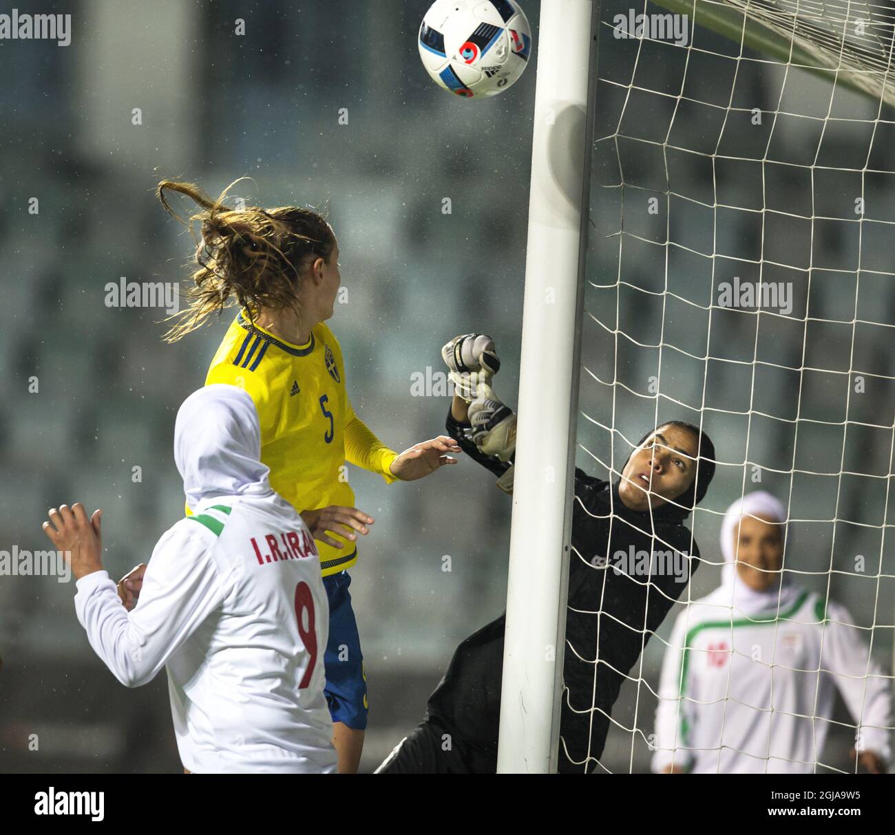 Iran's goalkeeper Mahdeyeh Molai (R) boxes the ball in front of Sweden's Nathalie Bjorn and Iran's Zahra Ghanbari during the international friendly soccer match between Sweden and Iran at the Old Ullevi Soccer Stadium in Goteborg, Sweden, October 21, 2016. Photo Thomas Johansson / TT / Kod 9200 ** SWEDEN OUT **  Stock Photo