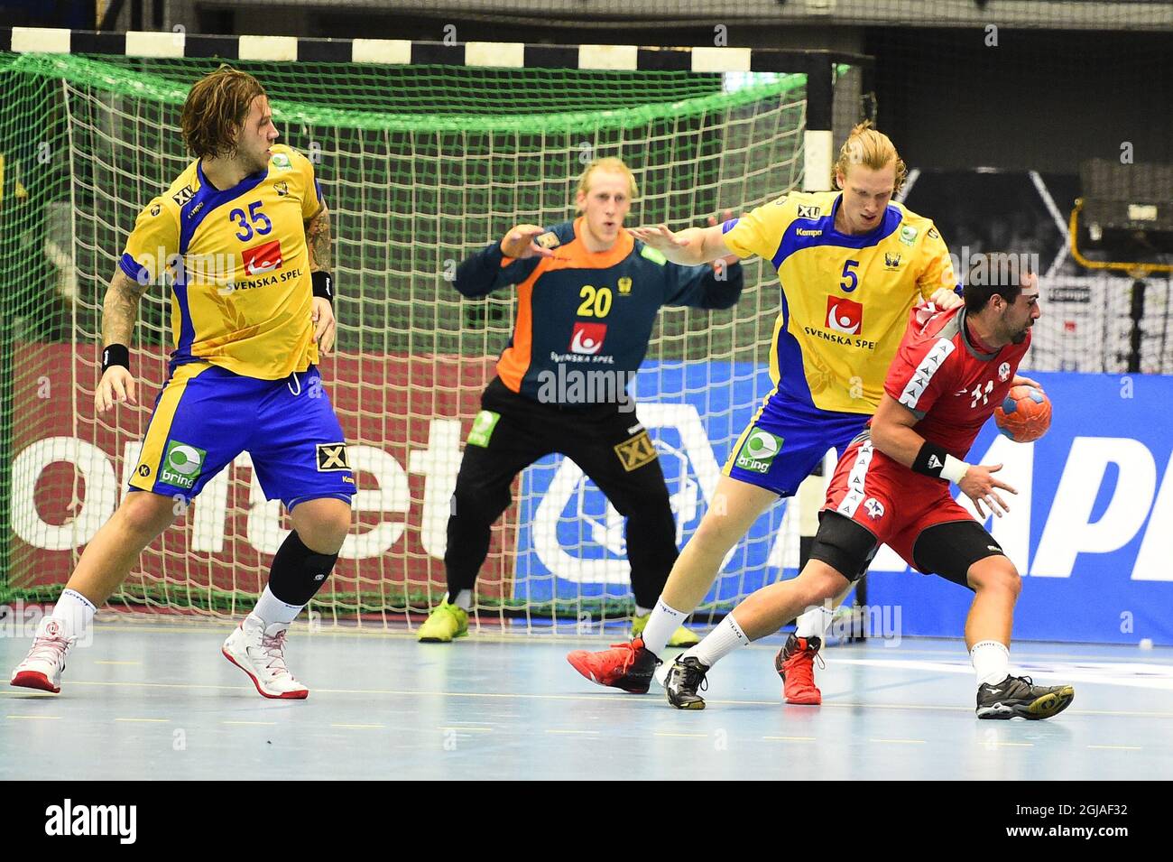 Sweden's Andreas Nilsson (L-R), goalkeeper Mikael Appelgren, Simon Jeppsson and Chil's Esteban Salinas in action during a fiendly handball match between Sweden and Chile at Baltiska Hallen in Malmoe, Sweden, on Jan. 09, 2017. Photo: Emil Langvad / TT / code 9290 Stock Photo