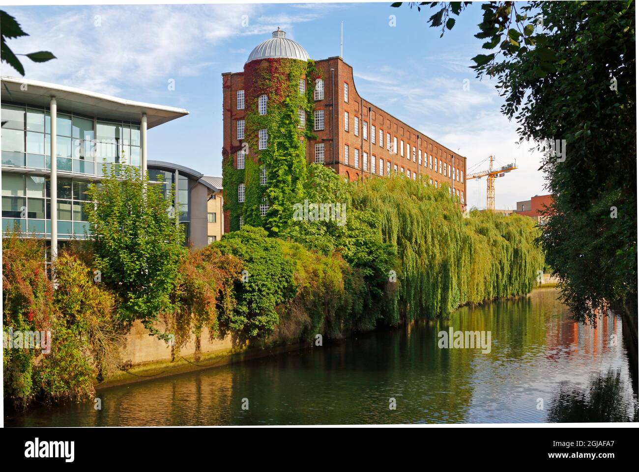 A view of the 19th century St James Mill by the River Wensum downstream of Whitefriars Bridge in the City of Norwich, Norfolk, United Kingdom. Stock Photo