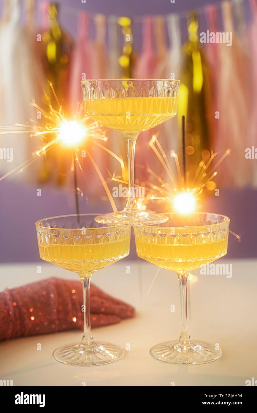 New Year Card Design with three glass of champagne and sparkler. On a ...