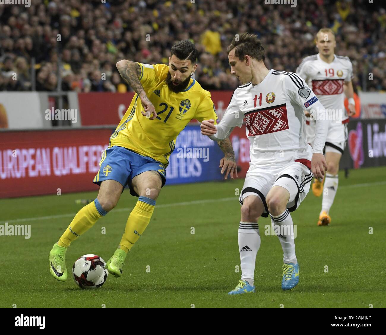 Sweden's Jimmy Durmaz and Belarus' Mikhail Gordeichuk during the FIFA World Cup Qualifier Europe Group A soccer match between Sweden and Belarus at Friends Arena in Solna, Sweden March 25, 2017. Photo: Janerik Henriksson / TT / Kod 10010  Stock Photo