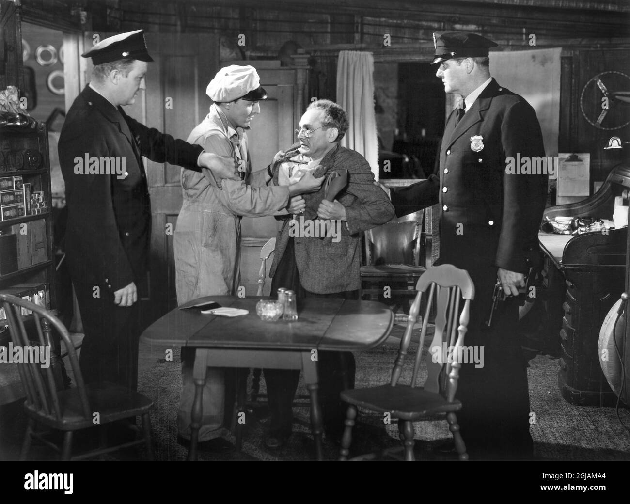 Tony Barrett f(center, left), on-set of the Film, 'Flame of Youth', Republic Pictures, 1949 Stock Photo