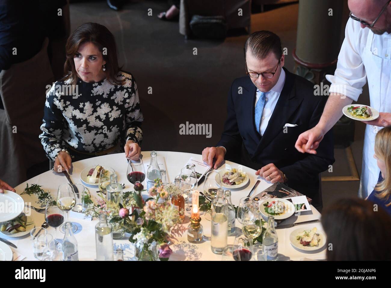 STOCKHOLM 20170530 Crown Princess Mary of Denmark and Prince Daniel of Sweden taste the food coked by Swedish and Danish chefs during a food and tourism event held at the Old National archive in Stockholm Sweden on Tuesday. The Danish Crown Prince couple are on an official visit to Sweden. Photo: Fredrik Sandberg / TT / kod 10080  Stock Photo