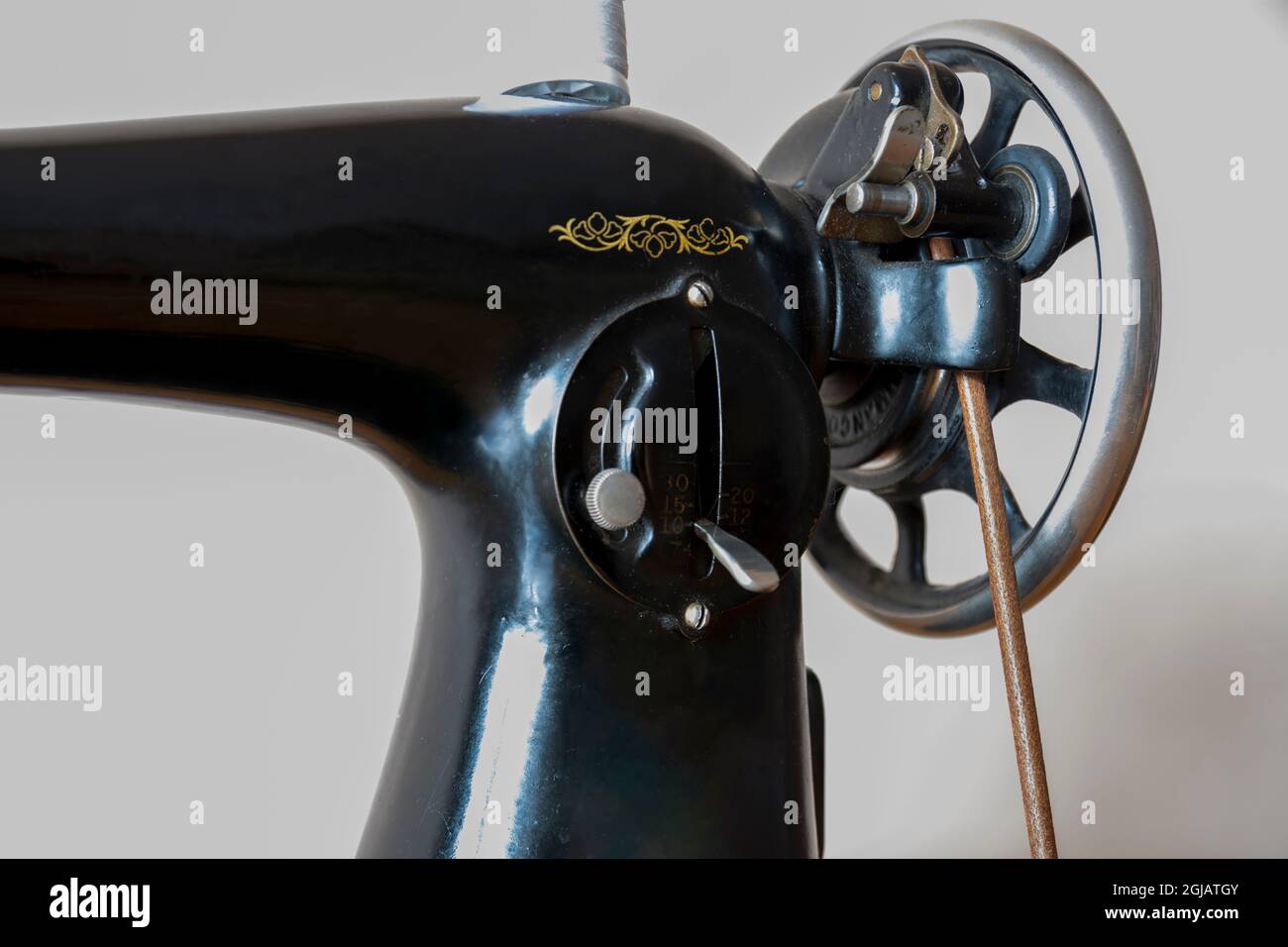 very old model, antique pedal sewing machine and table Stock Photo Alamy