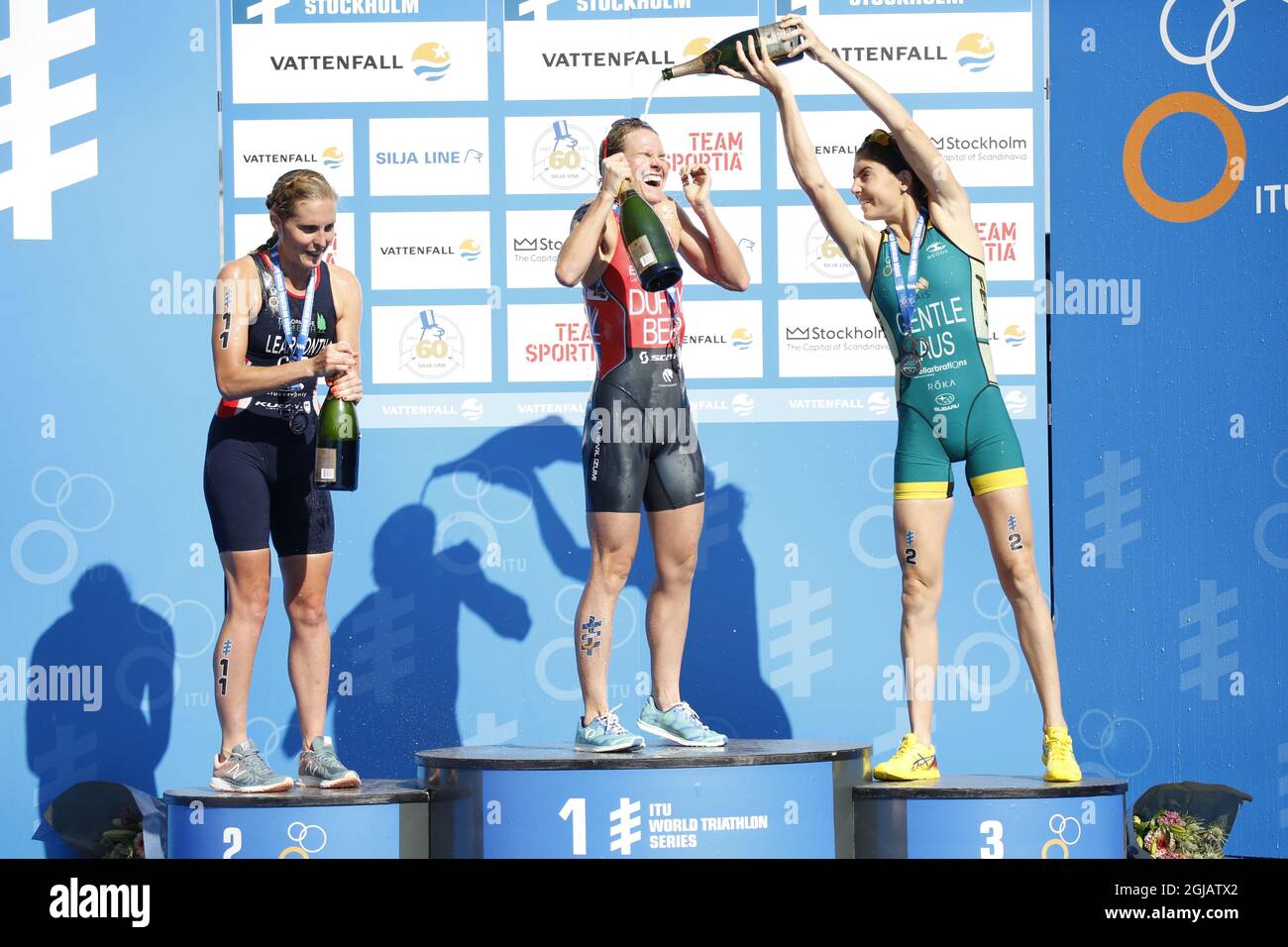 STOCKHOLM 2017-08-26 Jessica Learmonth, United Kingdom, Flora Duffy, Bermuda and Ashleigh Gentle, Australia with their medals and champagne after the women's triathlon competition in the ITU World Triathlon Series in central Stockholm, Sweden, August 26, 2017. Photo: Christine Olsson / TT / Code 10430  Stock Photo