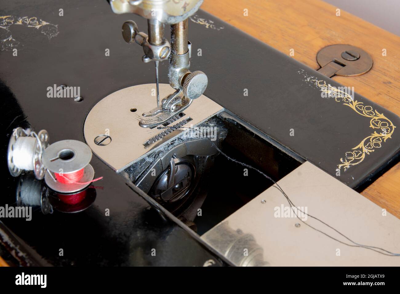 very old model, antique pedal sewing machine and table Stock Photo Alamy