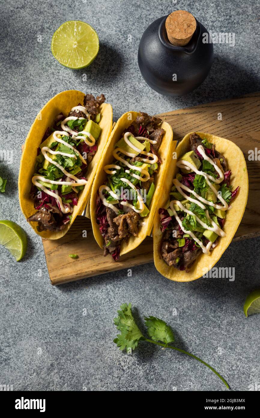 Homemade Korean Beef Bulgogi Tacos with Avocado and Cabbage Stock Photo