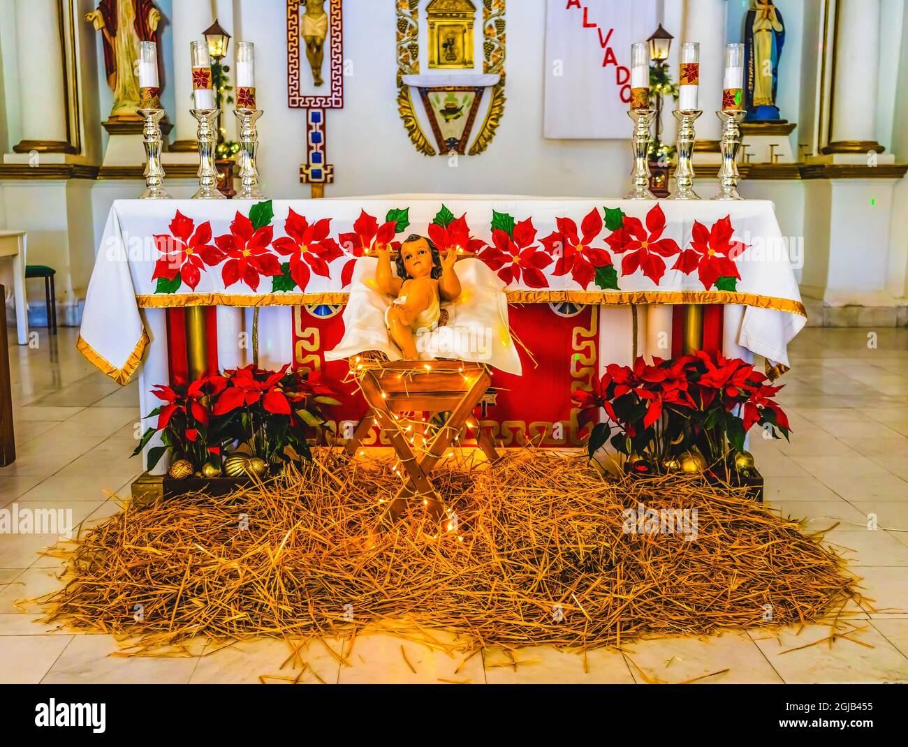 Basilica altar Christmas Creche Nativity, Mission San Jose del Cabo, Mexico. Spanish words above altar 'A savior has been born to us'. Mission founded Stock Photo