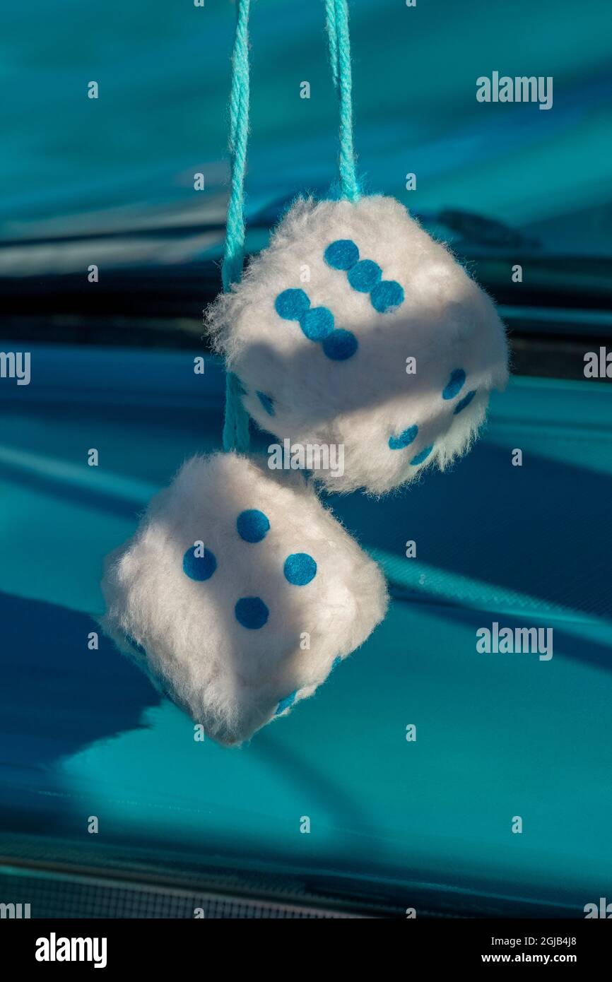 Fuzzy dice in classic car Stock Photo Alamy