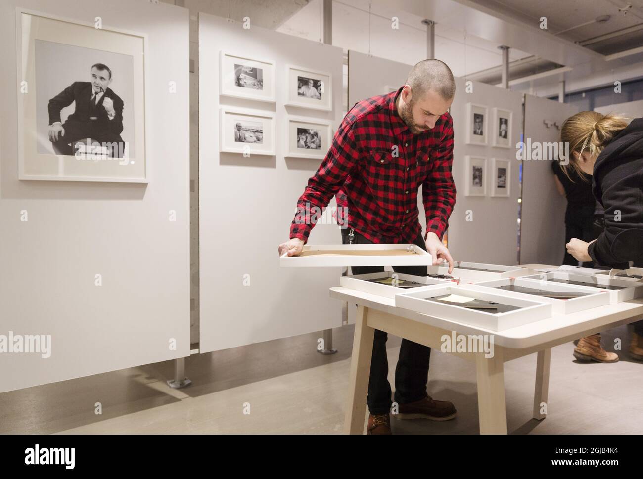 Employees hang pictures of Ingvar Kamprad, founder of Swedish multinational furniture retailer IKEA, in the entrance of the IKEA museum in Almhult, Sweden, on Jan. 28, 2018. Kamprad has died at an age of 91. The first ever IKEA store was opened in Almhult, and Kamprad grew up in the area. Photo: Ola Torkelsson / TT / code 75777  Stock Photo