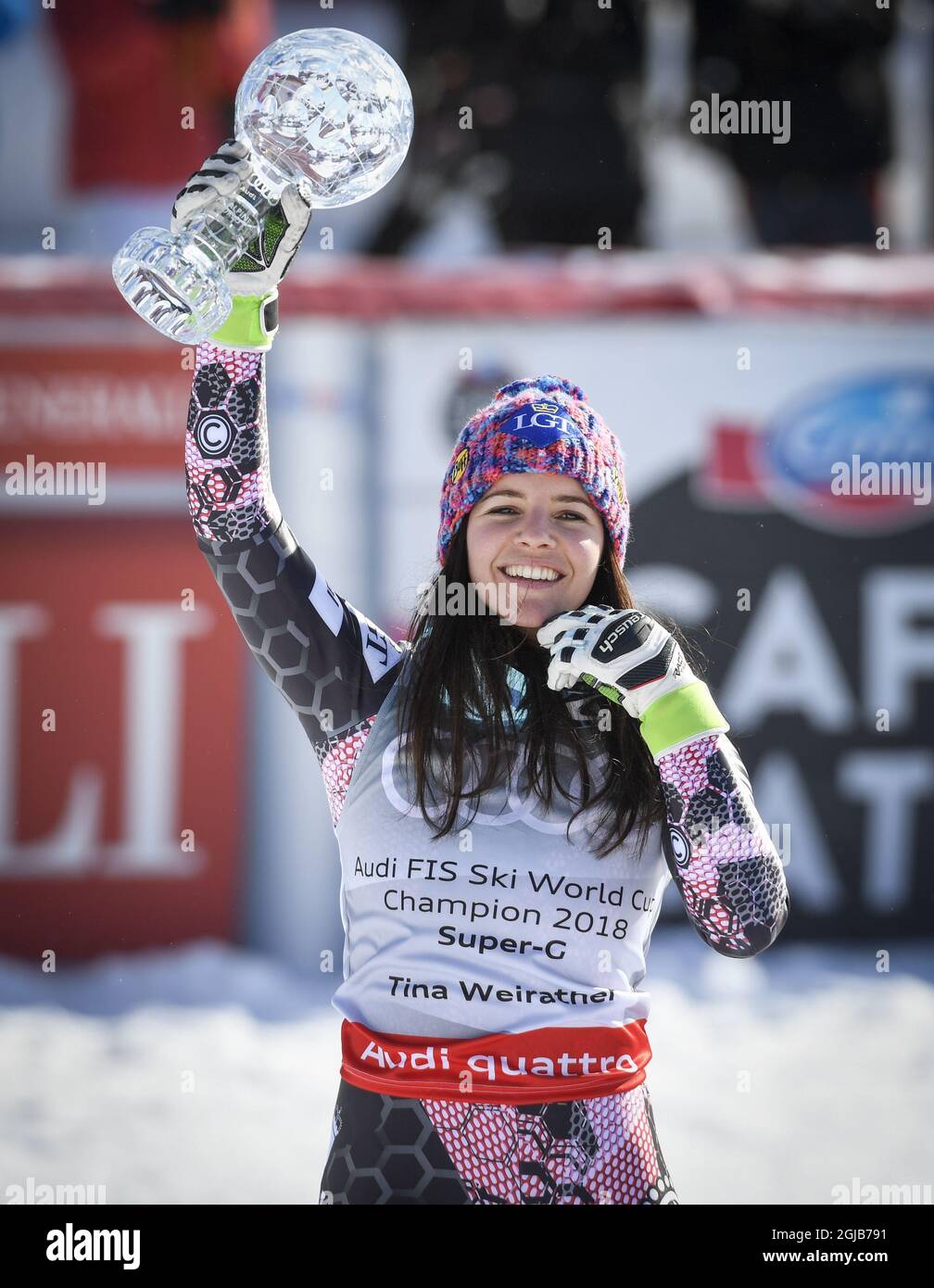 Tina Weirather, Liechtenstein, celebrates with the trophy after winning