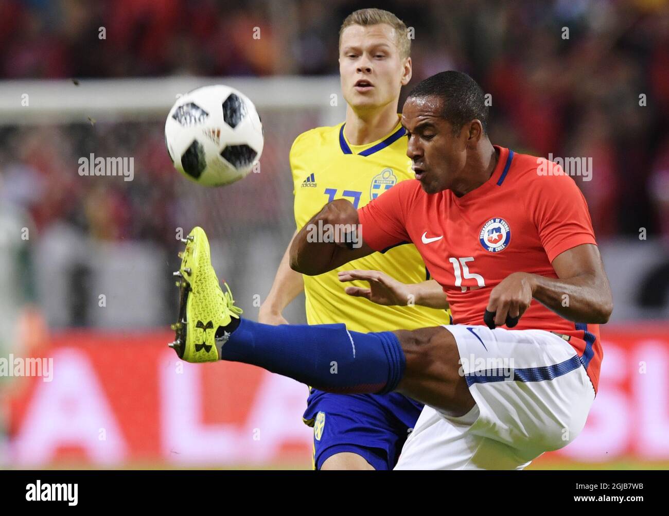 Sweden's Viktor Claesson (L) fights for the ball tiwh Chile's Jean Beausejour during the international friendly soccer match between Sweden and Chile at Friends Arena in Solna, Stockholm, on March 24, 2018. Photo: Anders Wiklund / TT / 10040  Stock Photo