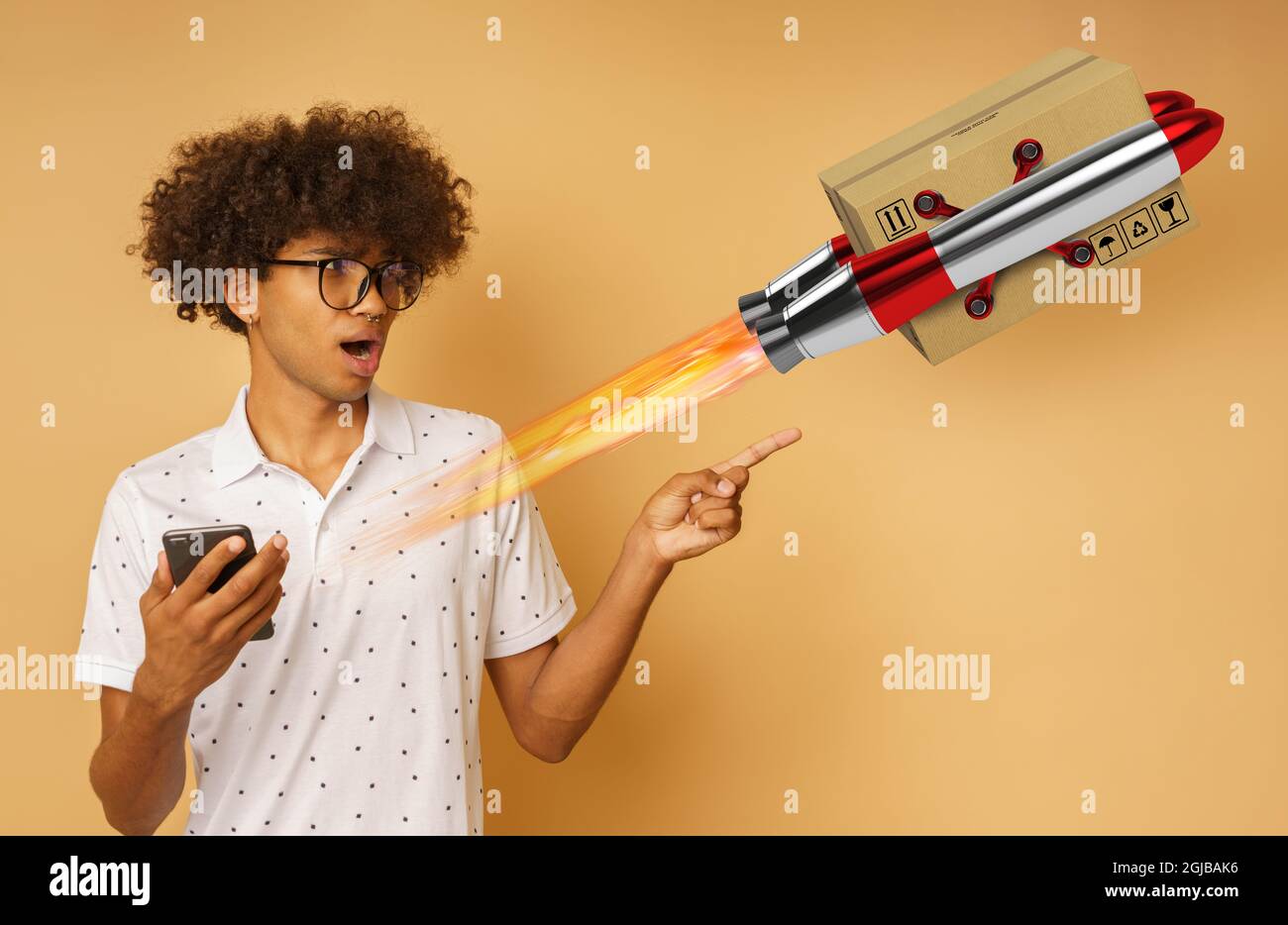 Amazed man with glasses indicates something with hand Stock Photo