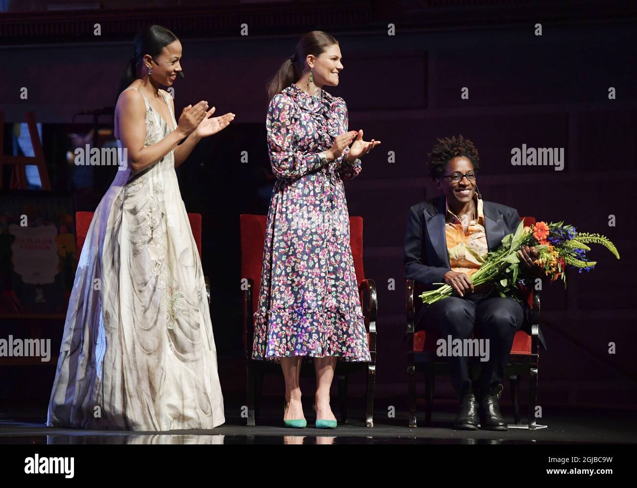 Swedish Culture and Democracy Minister Alice Bah Kuhnke (L) and Crown Princess Victoria (C) give applauds as American author Jacqueline Woodson (R), laureate of the 2018 Astrid Lindgren Memorial Award (ALMA) is celebrated during the award ceremony at the Stockholm Concert Hall on May 28, 2018. Photo: Jessica Gow / TT / code 10070  Stock Photo