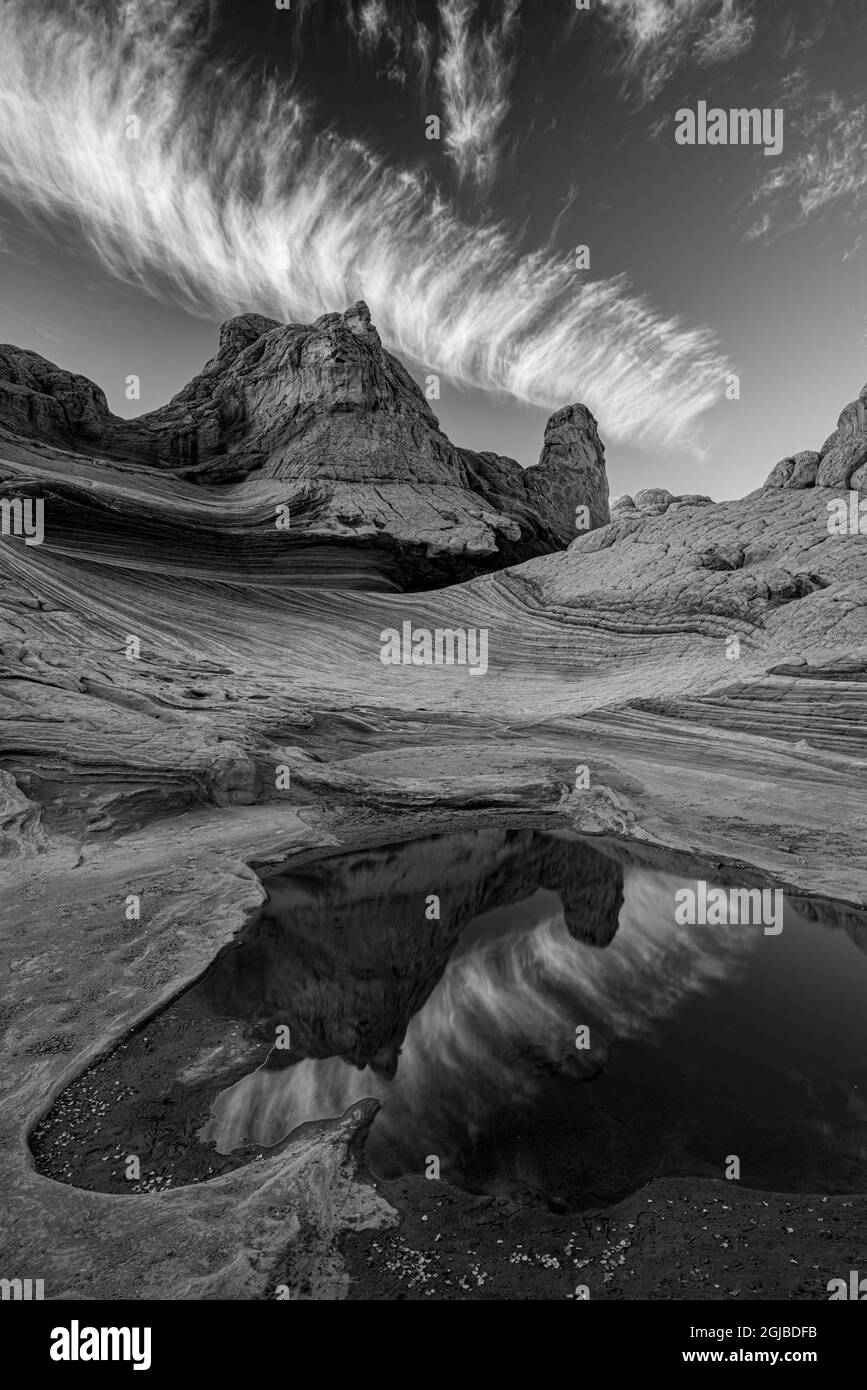 Black and white scenic of contrail and reflection, White Pockets Wilderness, Arizona, USA. Jet contrail emissions are a form of pollution. Stock Photo