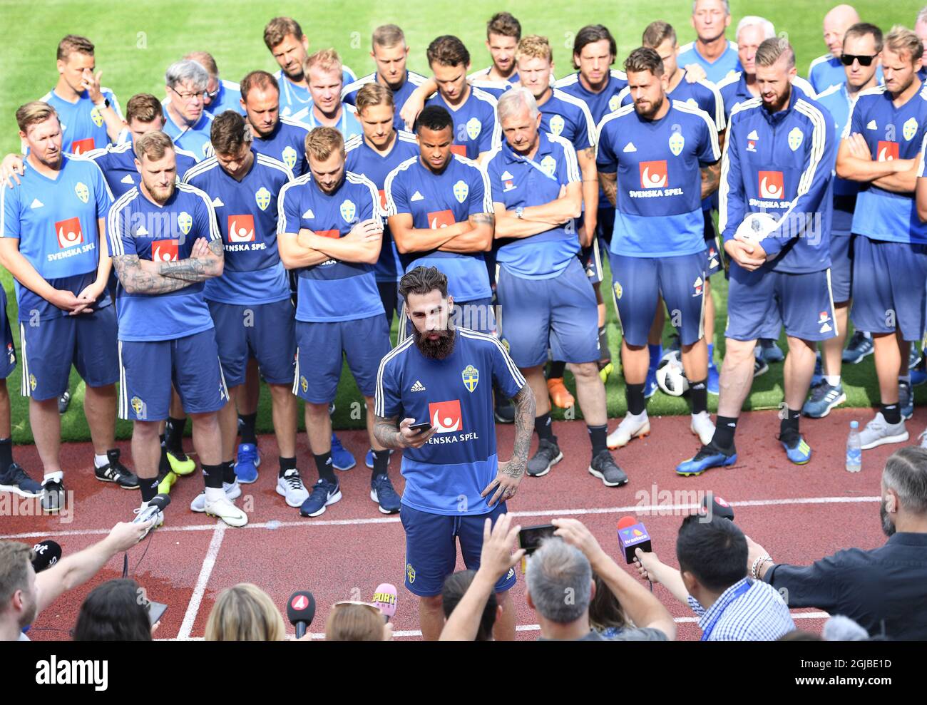 Swedish national soccer player Jimmy Durmaz speaks during a press conference, backed by his team, in connection to the team's training session at Spartak Stadium in Gelendzjik on June 24, 2018, the day after the World Cup group match against Germany. Durmaz was harrased wigh racist comments on internet after the loss  against Germany.  Stock Photo