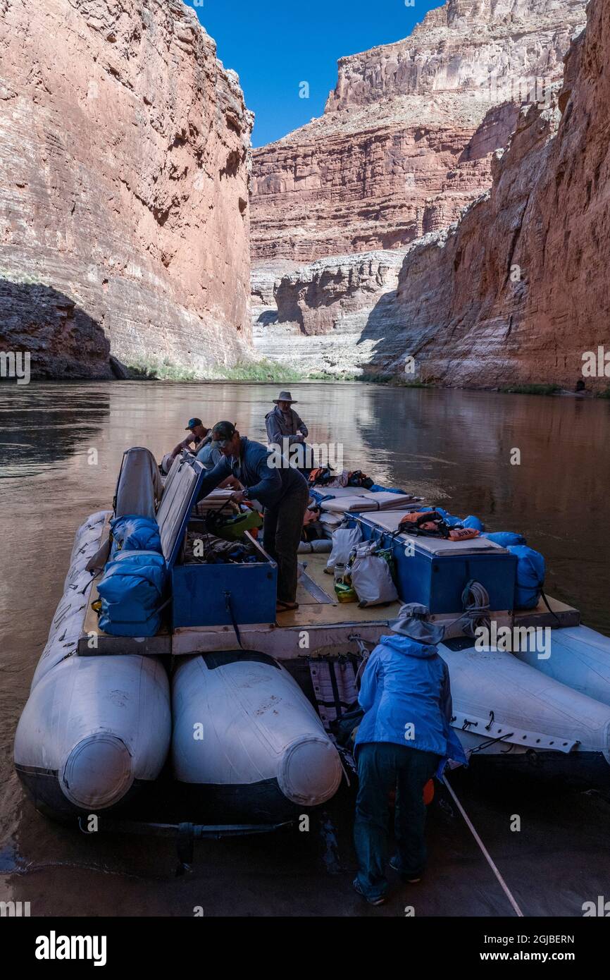 USA, Arizona. Passengers with raft on a float trip down the Colorado River, Grand Canyon
