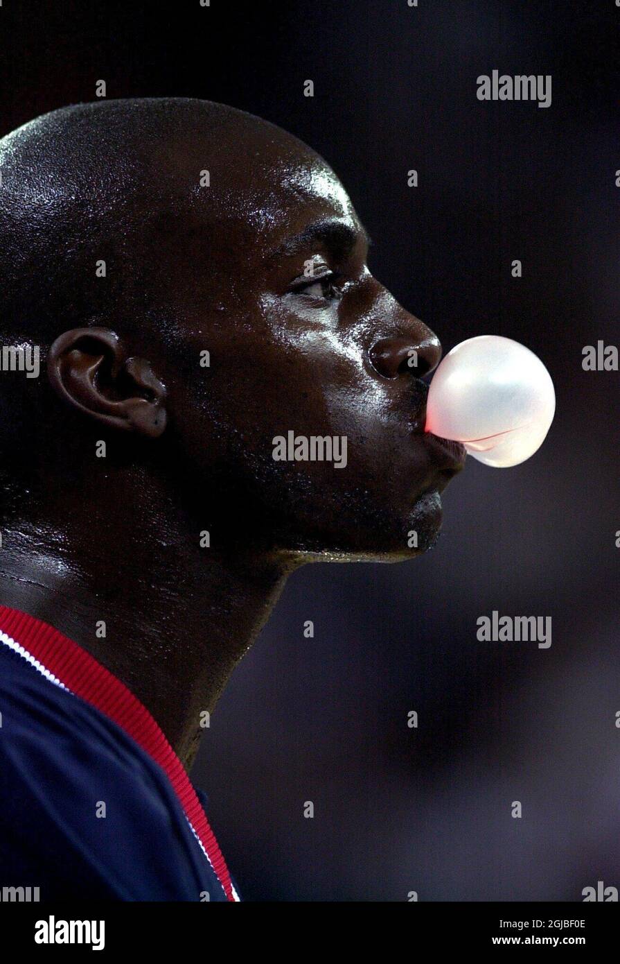 USA's Kevin Garnett blows bubble gum bubbles during the game.   Stock Photo