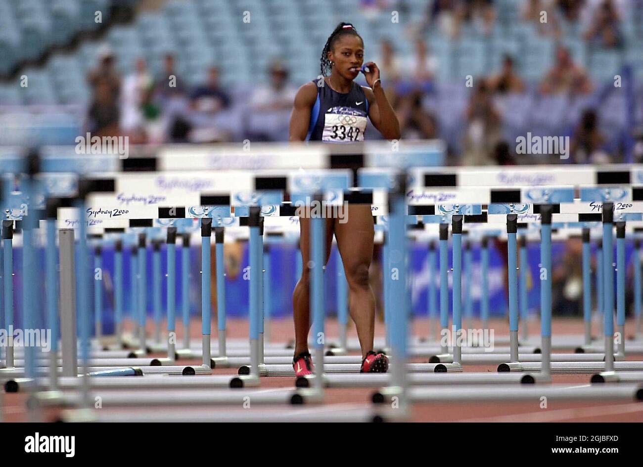 USA's Gail Devers bites her nails after strangely pulling up during the