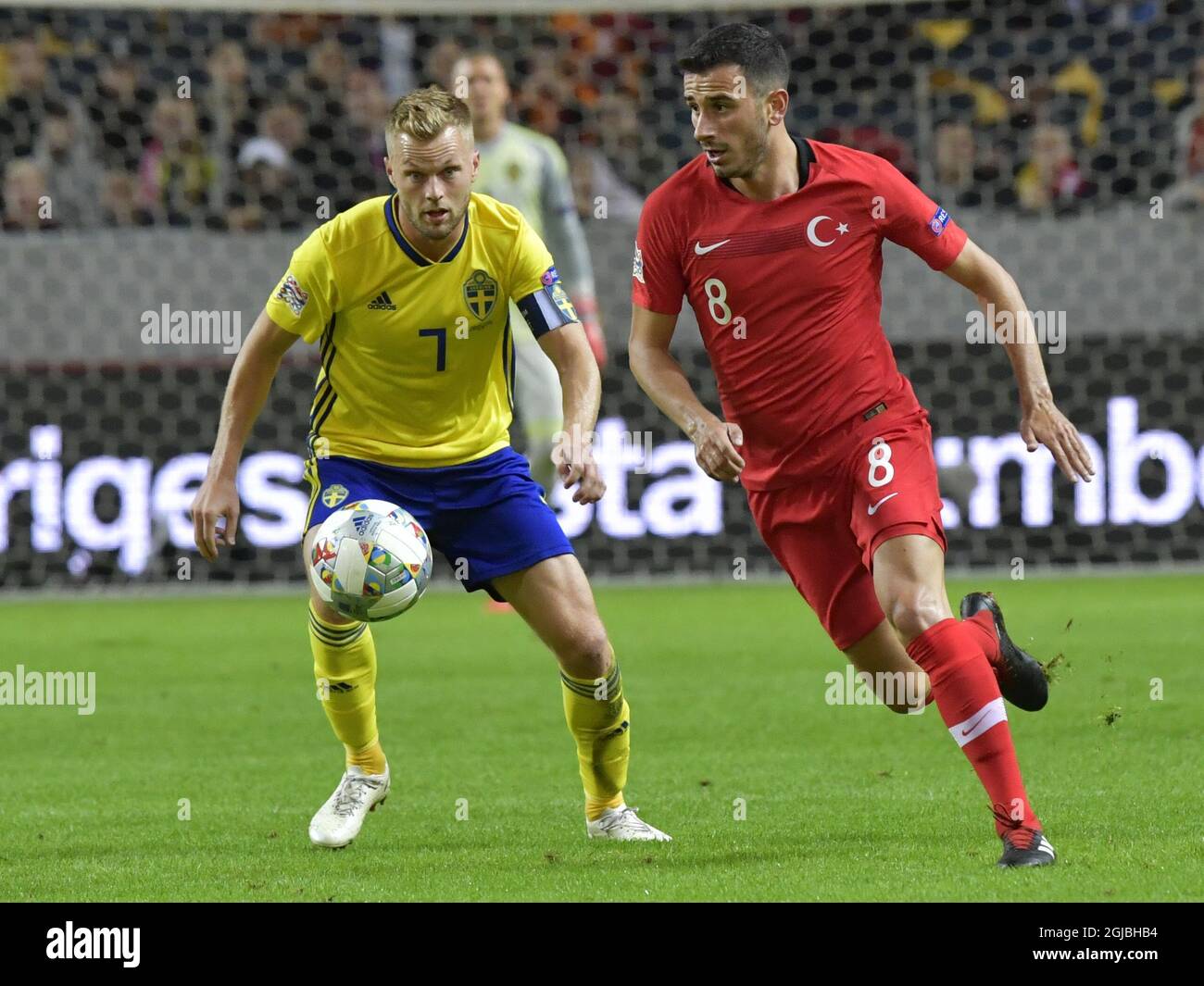 Sweden's Sebastian Larsson (L) fights for the ball with Turkey's Oguzhan Ozyakup during the UEFA Nations League, league B, group 2, soccer match between Sweden and Turkey at Friends Arena in Solna, Stockholm, Sweden, on Sept. 10, 2018. Photo: Jonas Ekstromer / TT / code 10030  Stock Photo
