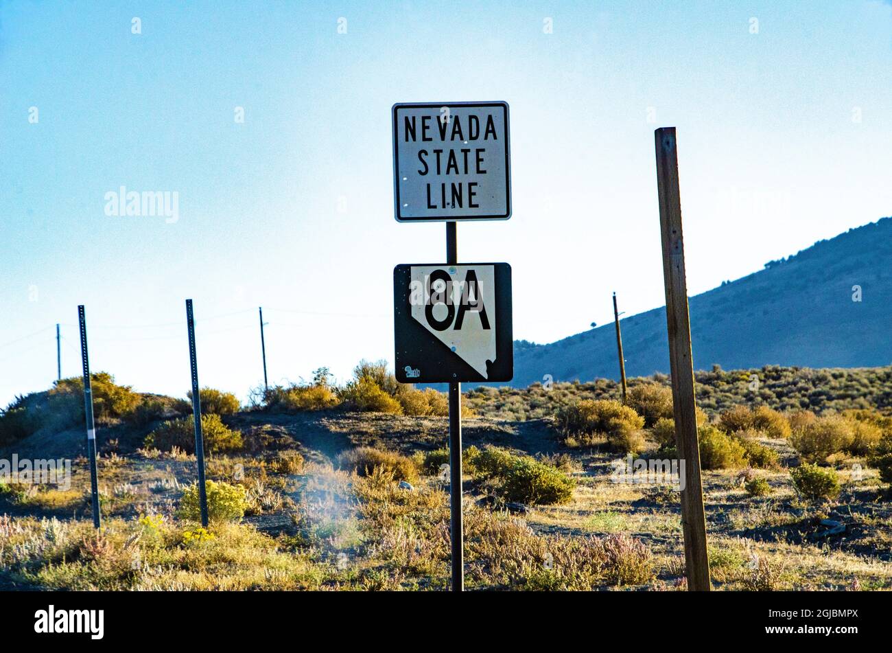 USA, Vya, Surprise Valley, California, Nevada border and highway sign Stock Photo