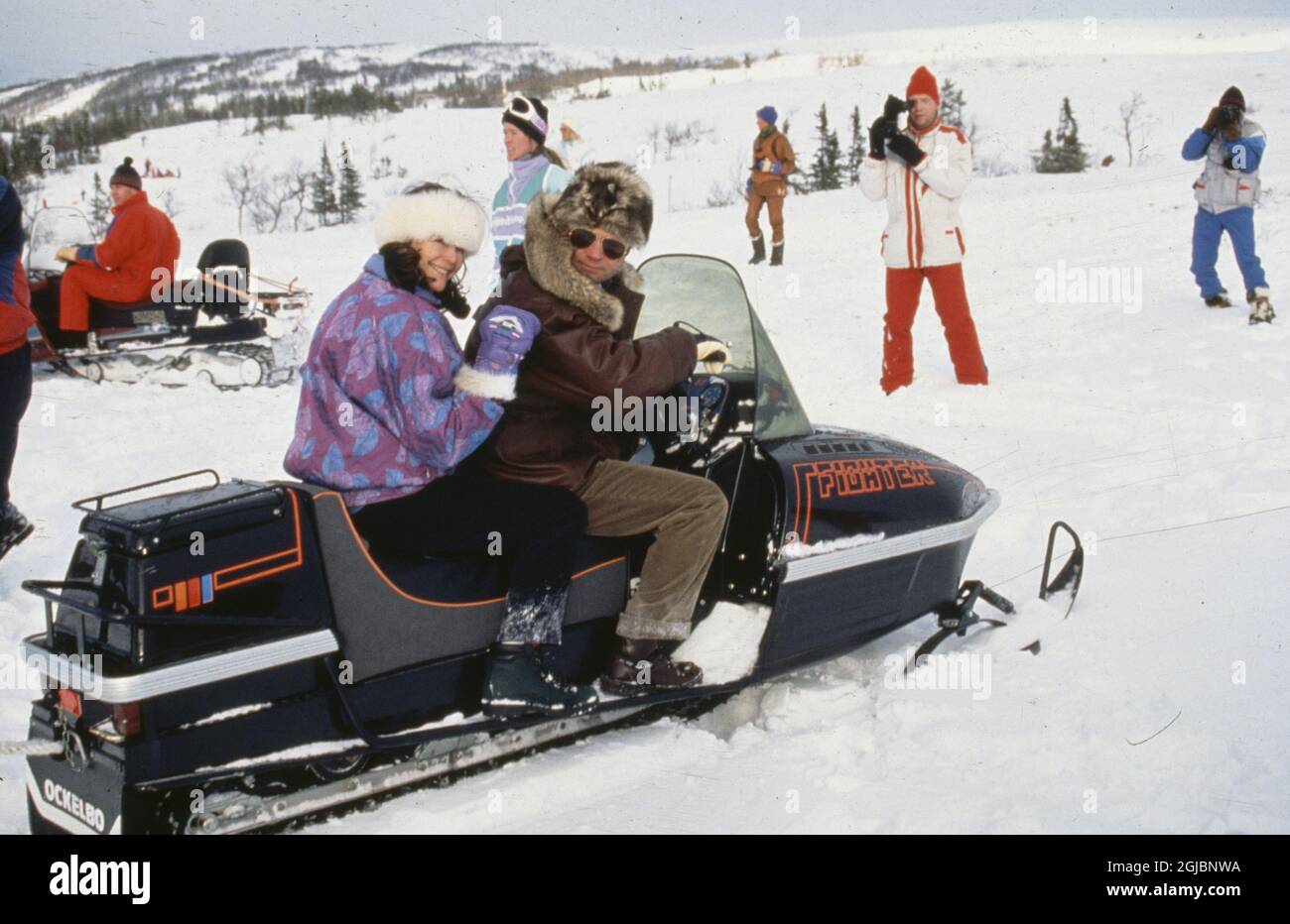 Queen SIlvia and King Carl Gustaf on a snowmobile in Storlien, 1991 (c) Charles Hammarsten / IBL  Stock Photo