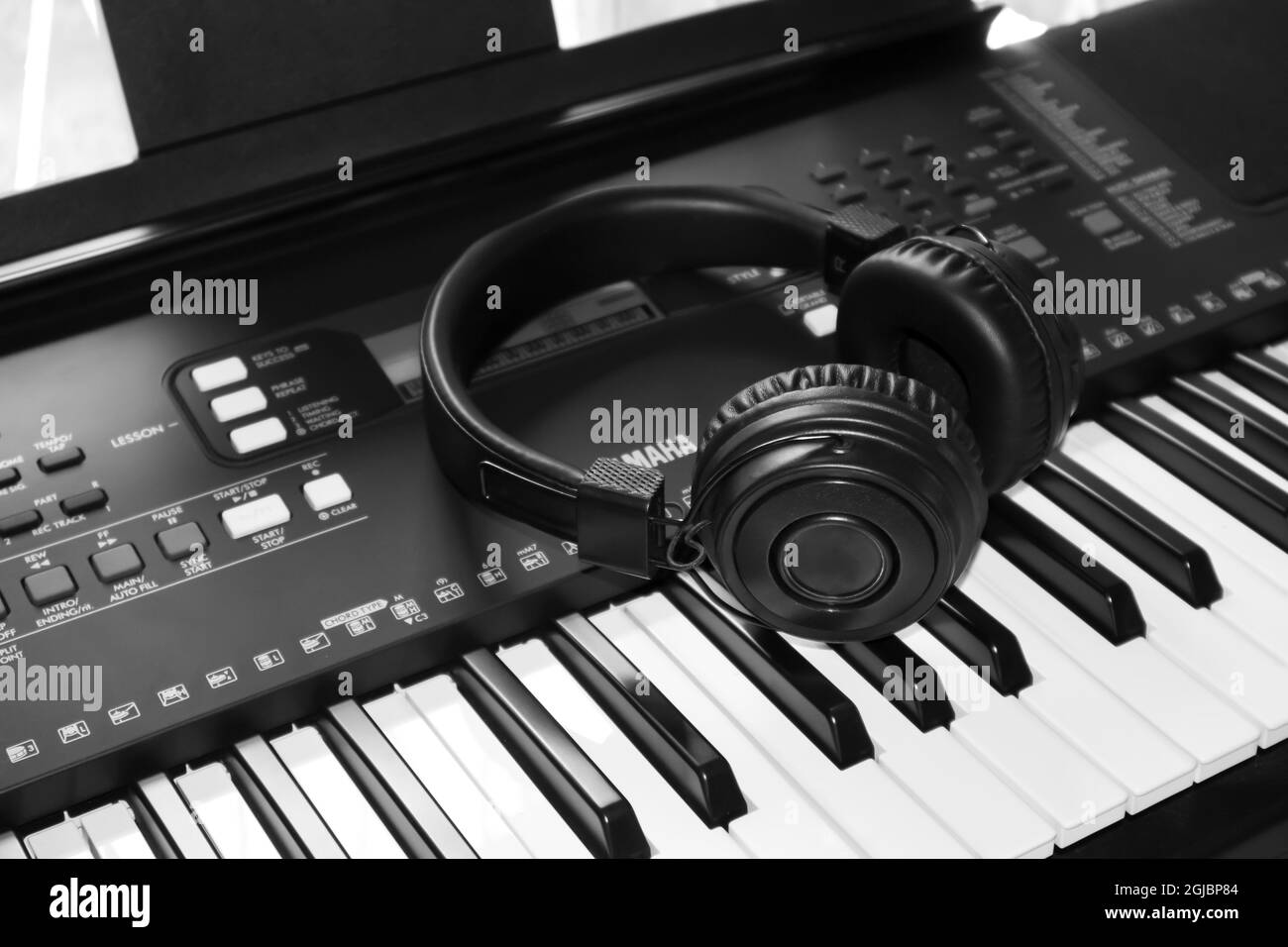 KALMUNAI, SRI LANKA - Sep 09, 2021: Headphone is on top of the YAMAHA Music Keyboard Closeup View Stock Photo