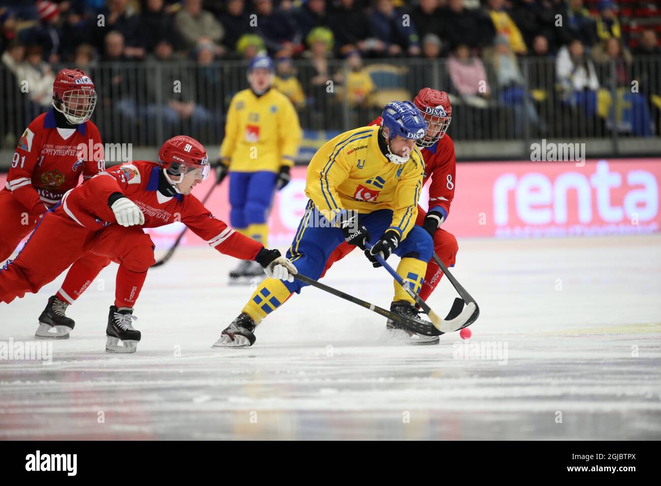 Russia's Artem Akhmetzyanov and Sweden's Per Hellmyrs during the Bandy  World Championship final match between Sweden