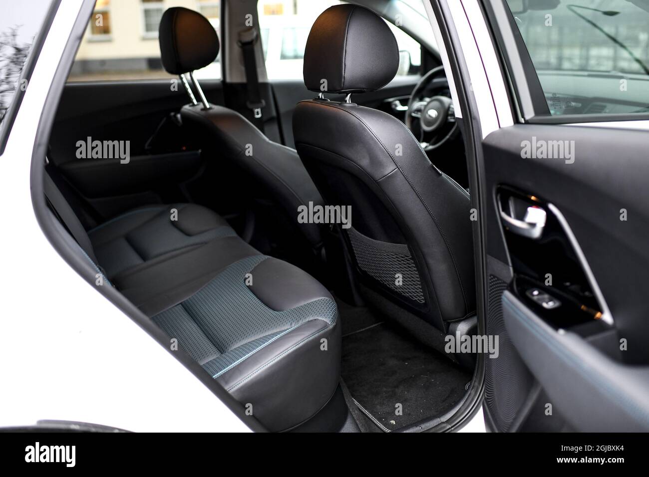 KIA eNiro electric car steering wheel dashboard controls car road