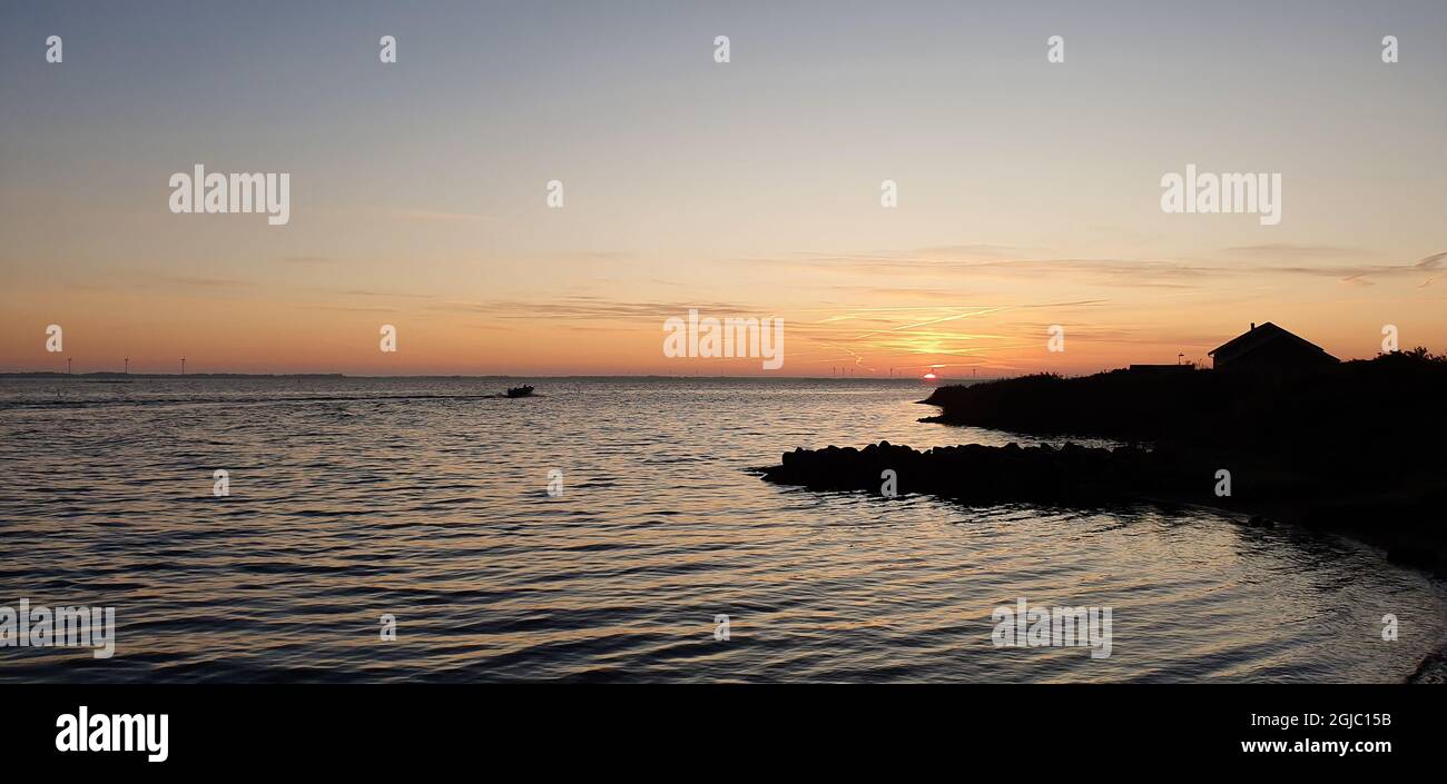 Peaceful evening on beach hi-res stock photography and images - Alamy