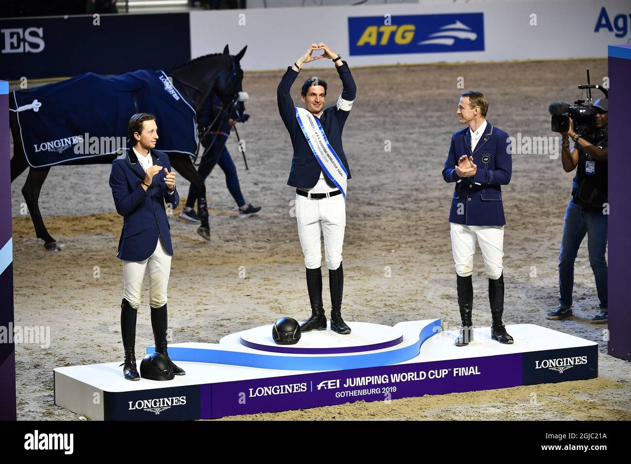 GOTHENBURG 20190407 From left Martin Fuchs of Switzerland second place, Steve Guerdat of Switzerland vinner and Swedens Peder Fredricson third place on the podium after FEI World Cup final 3 show jumping event at Gothenburg Horse Show in Scandinavium Arena April 7, 2019. Photo Bjorn Larsson Rosvall / TT kod 9200  Stock Photo