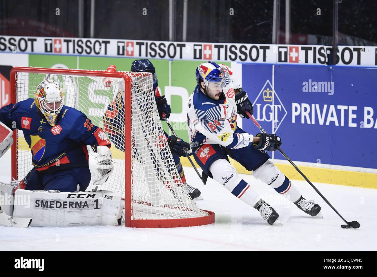 MÃ¼chens Trevor Parkes (R) with the puck behind Djurgardens goalkeeper  Karri Ramo during the first Champions Hockey League quarterfinal between  Djurgarden Hockey and Red Bull Munich at Hovet in Stockholm, Sweden, on