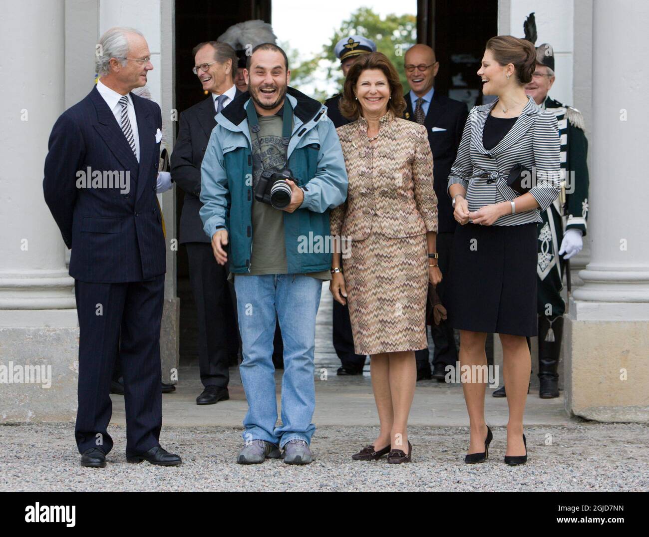 King Carl XVI Gustaf, Queen Silvia and Crown Princess Victoria was joined by Brazilian photographer Beto Barata when pictures was taken at Rosersberg castle outside Stockholm. He asked in portugese if he could join them and the queen gave her approval.   Stock Photo