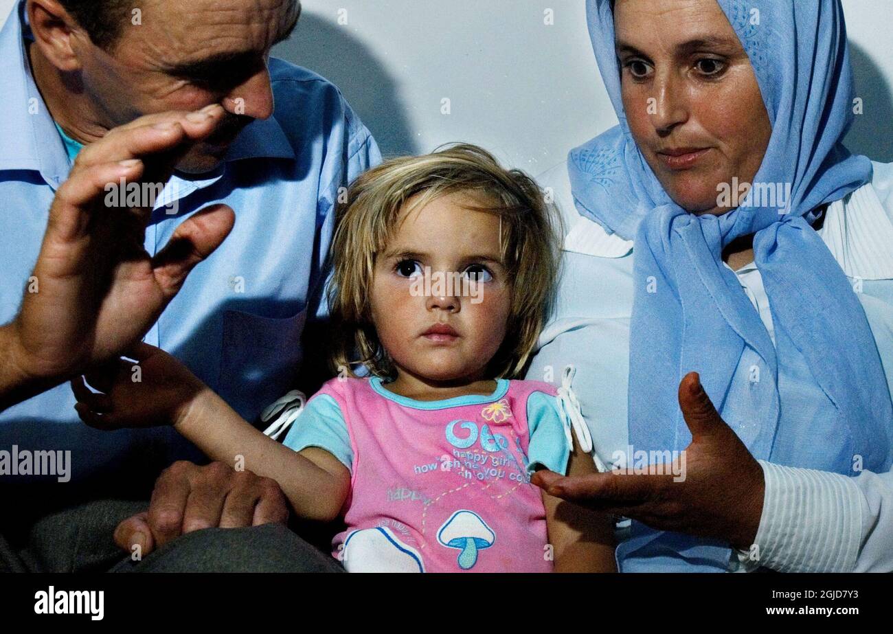3 year old Bushra Binhisa with her parents at the family home in the city of Zinat, Morocco.  A picture of Bushra stirred up the world's press with her likeness with missing English girl Madeleine McCann.  Stock Photo