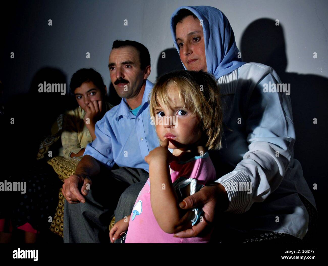 3 year old Bushra Binhisa with her parents at the family home in the city of Zinat, Morocco.  A picture of Bushra stirred up the world's press with her likeness with missing English girl Madeleine McCann.  Stock Photo
