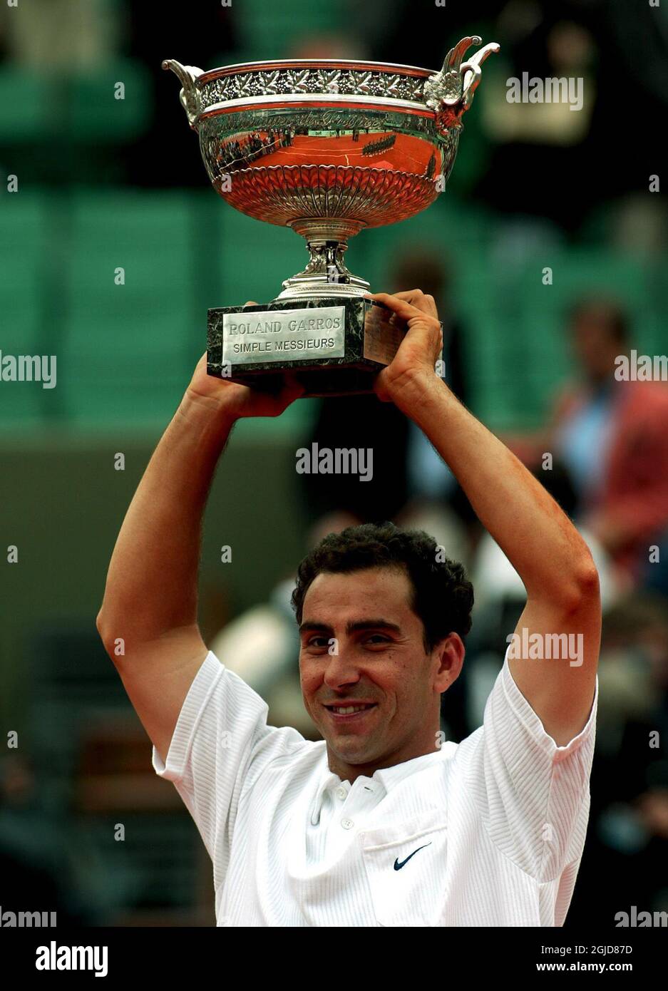 Alberto Costa of Spain celebrates with the French Open trophy after his victory over compatriot Juan Carlos Ferrero   Stock Photo