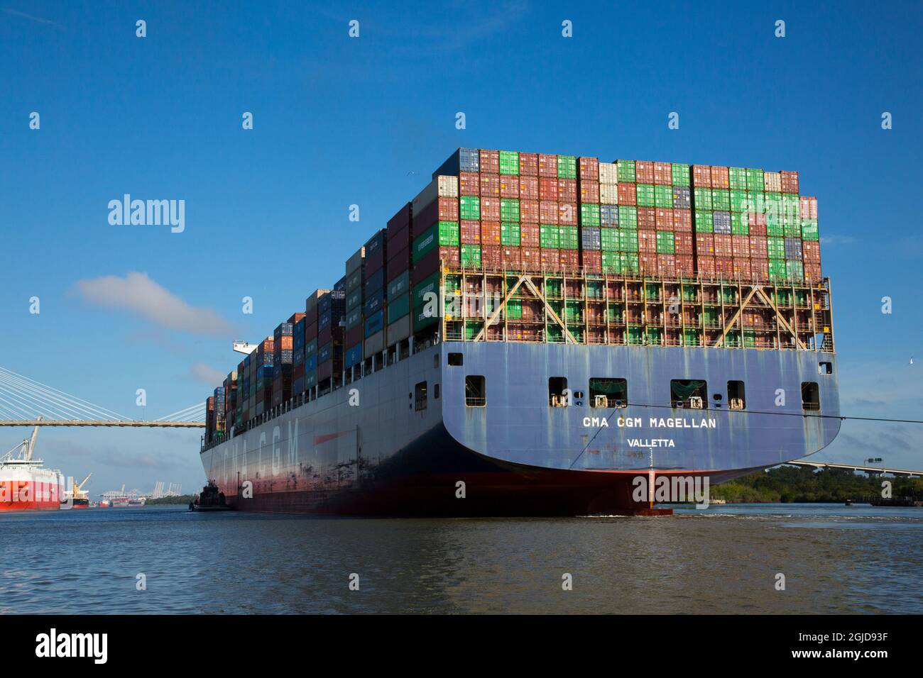 USA, Georgia, Savannah. Container ship approaching the Talmadge Bridge ...