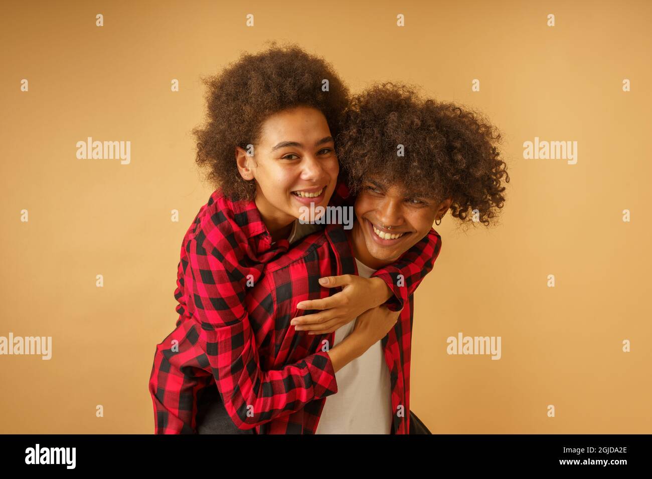Happy and carefree afro boyfriend and girlfriend play together Stock Photo