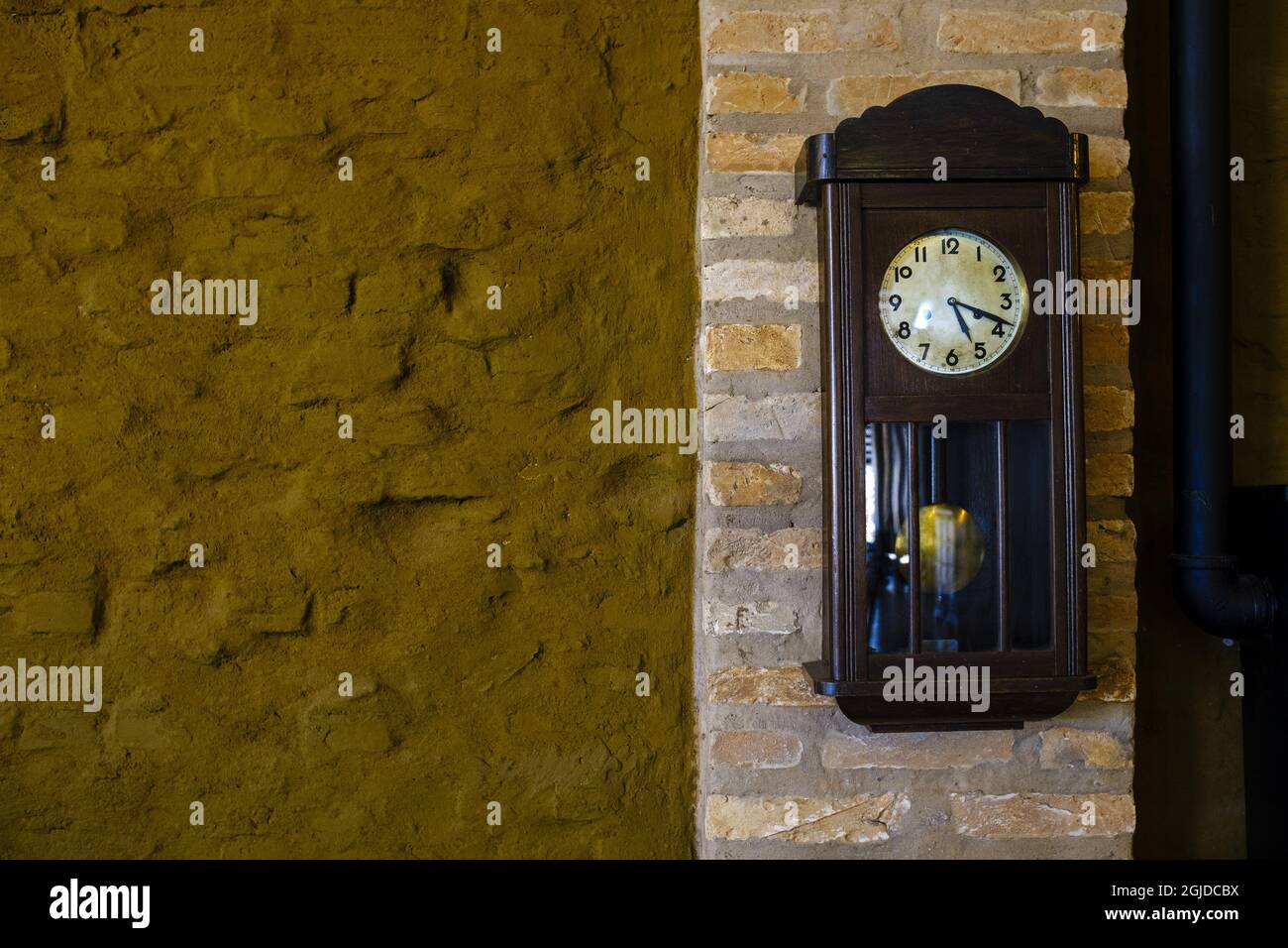 Wall mounted wooden pendulum clock hi-res stock photography and images ...