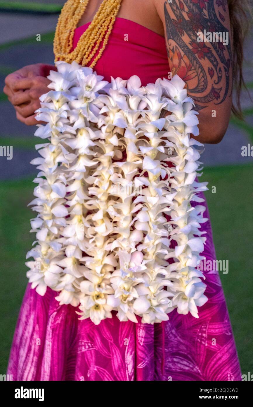 Hawaiian woman carrying leis, Hawaii, USA. Stock Photo