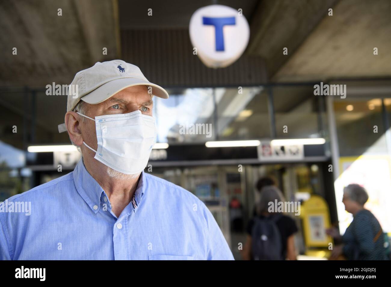 An elderly man (model) wearing personal protective equipment (PPE
