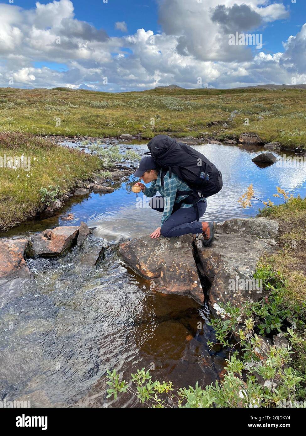 Crown Princess Victoria drinking water from a mountain stream. This weekend Crown Princess Victoria and Prince Daniel hiked the 47-kilometer-long Jamtland Triangle in Sweden, September 06, 2020. The couple hiked between the mountain stations Storulvan, Sylarna and Blahammaren and then back to Storulvan. Photo: Royal Court / Handout / code 10500 **MANDATORY CREDIT: Photo: Royal Court ** ** For editorial use only. The image comes from an external source and is distributed in its original form as a service to our subscribers **  Stock Photo