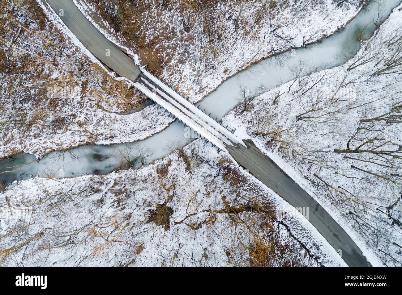 Aerial view of winter forest, bridge, and creek Stephen A. Forbes State Park, Marion County, Illinois. Stock Photo